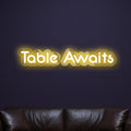 table-awaits-neon-sign